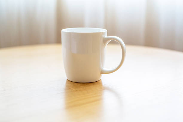 istock white porcelain cup on wooden table 510969788
