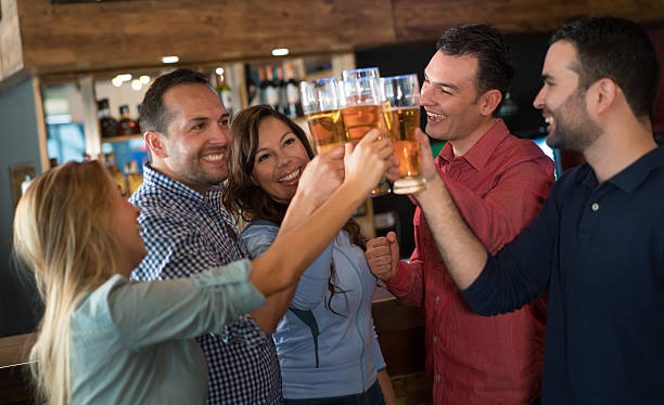 istock Group of friends having drinks at the bar 510970216