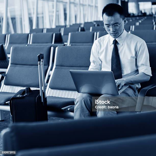 Waiting Traveller Using Mobile Phone Stock Photo - Download Image Now - 30-34 Years, Adult, Adults Only