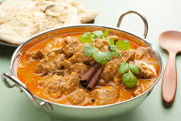 istock Indian Curry Lamb Rogan Josh Naan Bread 510973927