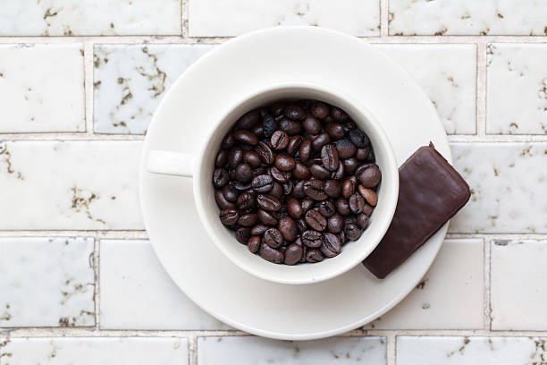 Cup full of coffee beans on Marble