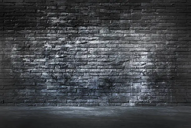 Photo of Black Brick Wall and Cement Floor