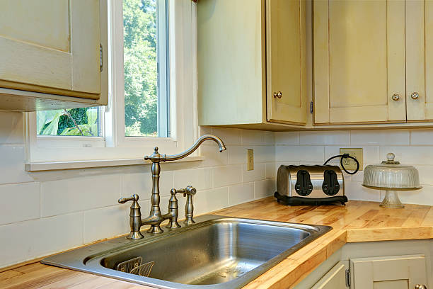 istock Kitchen cabinet with sink. View of faucet 510976195
