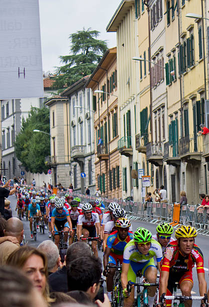 UCI Road World Championships. Toscana 2013. Florence, Italy - September 27, 2013: UCI Road World Championships. The coming of the cyclists trough public uci road world championships stock pictures, royalty-free photos & images