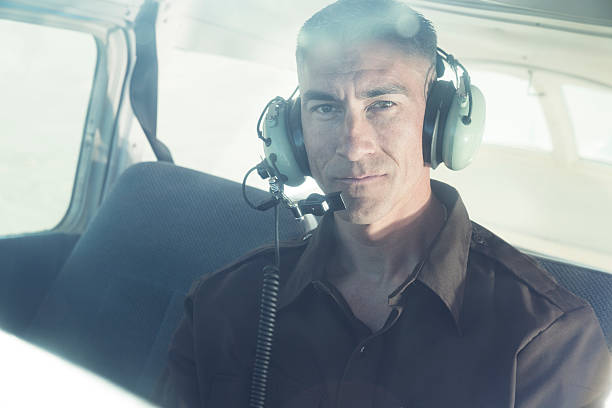 istock Pilot of a small plane in cockpit wearing radio headset 510977197