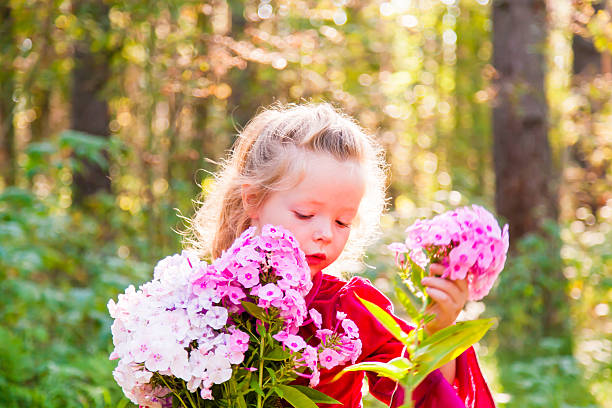 istock Girl with flowers 510979843