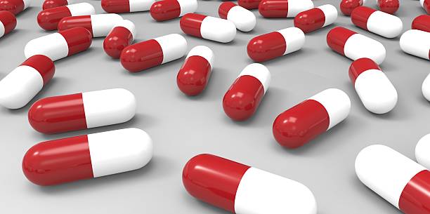 istock red and white color pills on gray grey background 510980835