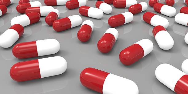 istock red and white color pills on gray grey background 510980901
