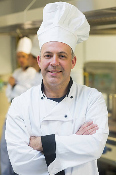 istock Proud mature chef posing in a kitchen 510981013
