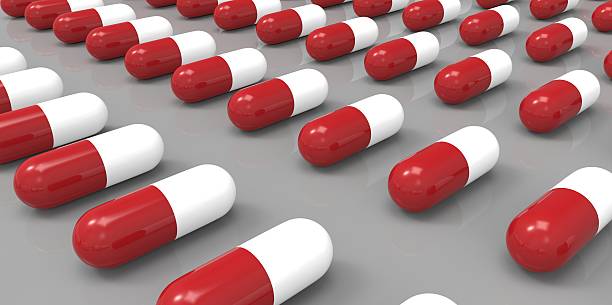 istock red and white color pills on gray grey background 510981023