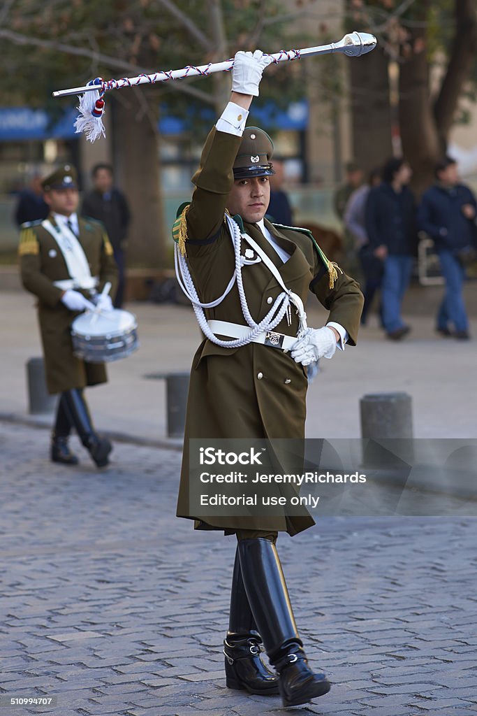 Changing of the Guard Ceremony Santiago, Сhile - August 8, 2014: Leader of the Carabineros Band marching as part of the changing of the guard ceremony at La Moneda in Santiago, Chile. La Moneda is the Presidential Palace in the centre of Santiago. Adult Stock Photo
