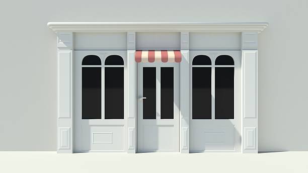 istock Sunny Shopfront with large windows White store facade 510995601