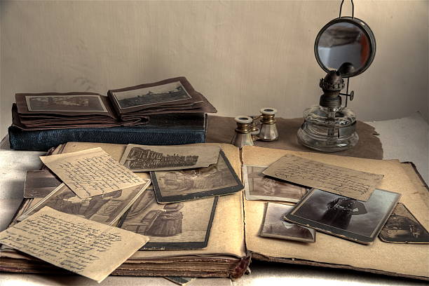 Old photos, books, albums, letters and oil lamp.