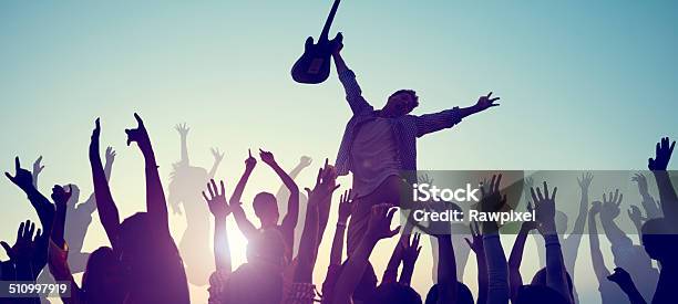 Group Of People Enjoying Live Music Stock Photo - Download Image Now - Jumping, Guitar, Cheerful