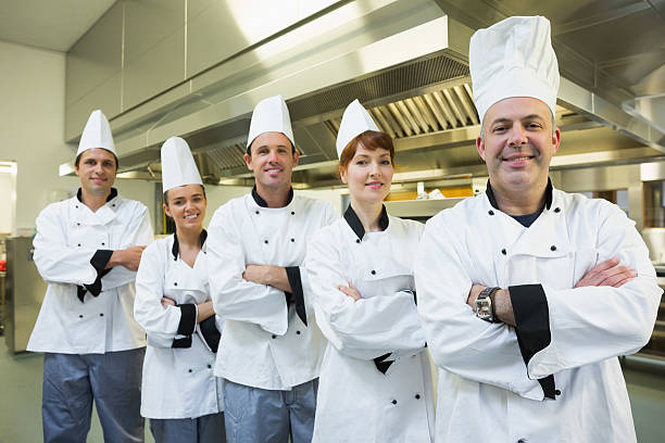 istock Team of chefs smiling at the camera 510998287