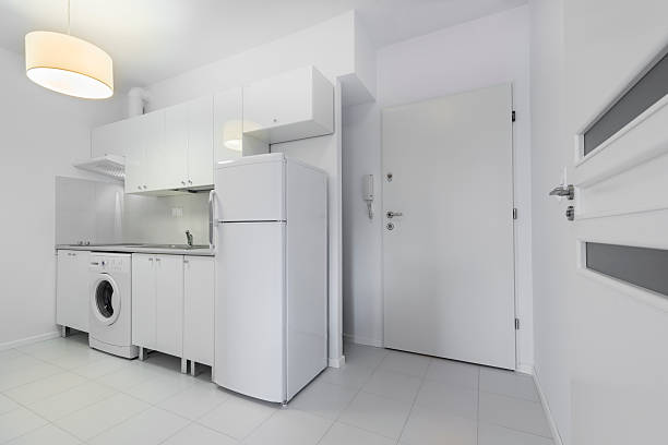 Small, white compact kitchen interior design stock photo