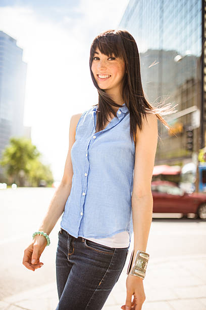 istock cheerful woman smiling on the city 511001085