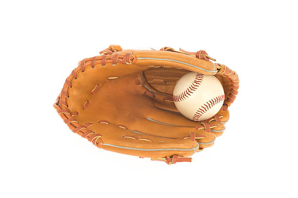 Boy wearing a baseball helmet and a glove