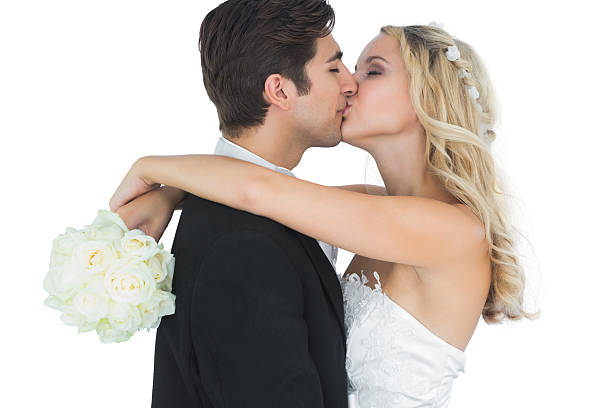 istock Nice bride embracing and kissing her husband 511002363