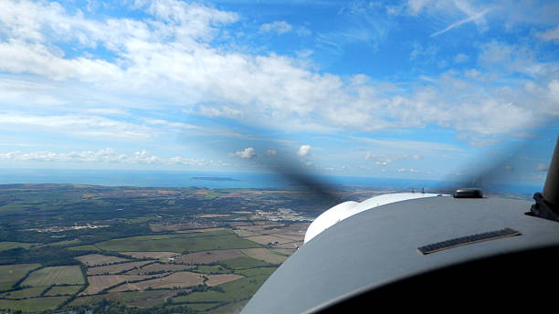 istock Image of small two-seater private plane flying in sky, flying-lesson 511002547