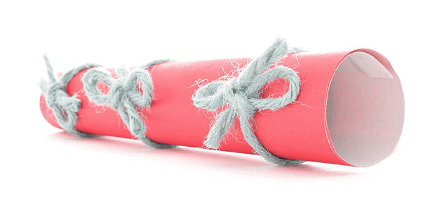 istock Red letter tube tied with string, three natural bows isolated 511009226