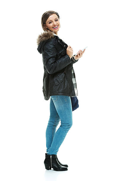 istock Cheerful woman holding phone 511009558