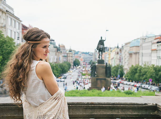 istock Hippy-looking woman tourist standing on Wenceslas Square, Prague 511010148