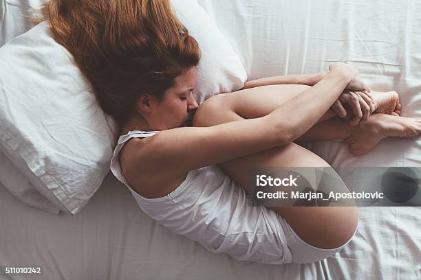 Lying Down And Sad Stock Photo - Download Image Now - Menstruation, Pain, Women