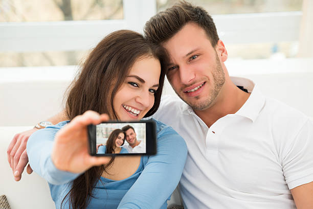 istock Happy Young Couple Taking A Selfie 511014618