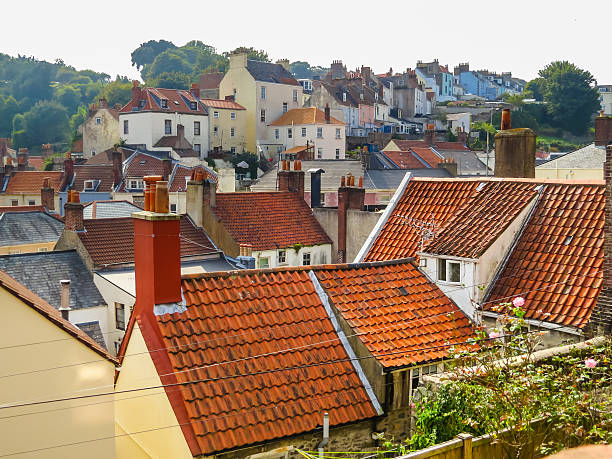 View of the Saint Peter Port, Bailiwick of Guernsey View on the roofs of Saint Peter Port. Bailiwick of Guernsey, Channel Islands guernsey city stock pictures, royalty-free photos & images