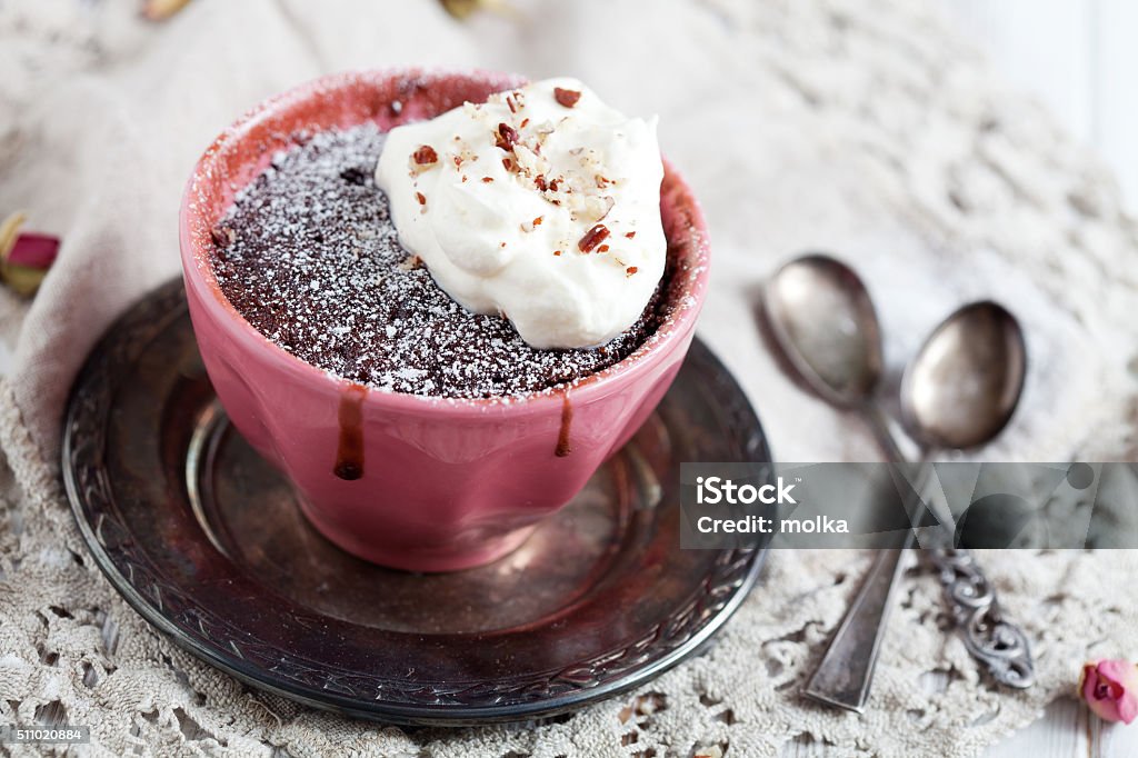 Mug cake Homemade chocolate mug cake with icing sugar Baked Stock Photo