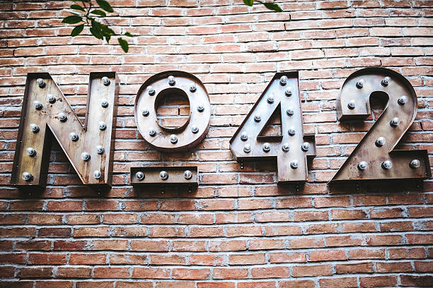 Number 42 Number 42 on brick wall. number 42 stock pictures, royalty-free photos & images