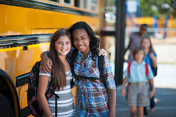 istock Two friends in elementary school are standing outside 511020994