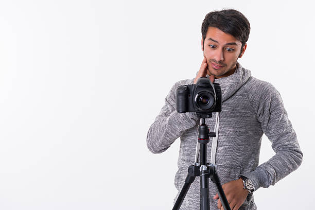 istock Photographer with camera and tripod 511021420