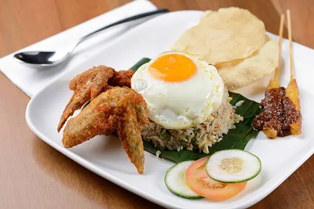 Photo of Oriental Fried Rice with egg, chicken wings and satay