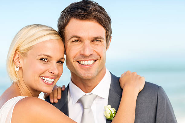 istock Bride With Groom Smiling Together On Beach 511021708