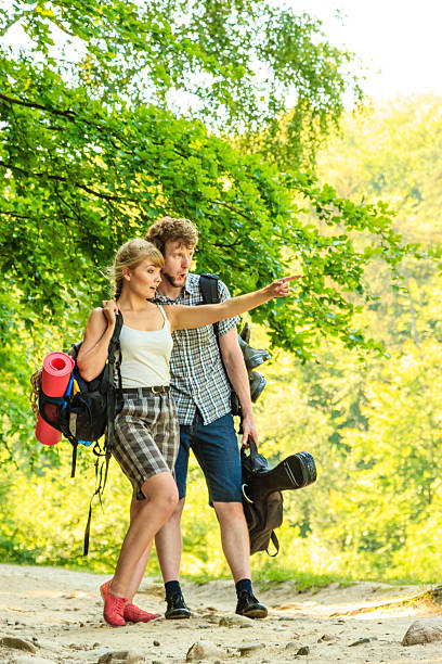 istock Hiking young couple with guitar backpack outdoor 511021918