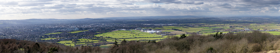 Panoramic view of Cheltenham taken from Cleeve Hill (the highest point in The Cotswolds) on a clear cold winters day. The famous Cheltenham Racecourse can clearly be seen, highlighted in a shaft of sunlight