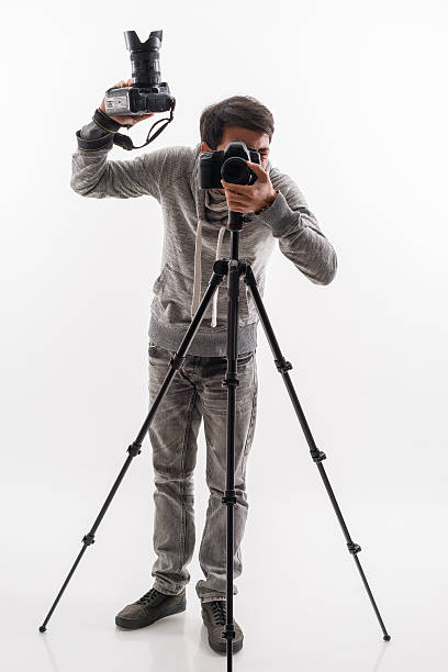istock Photographer with camera and tripod 511023590