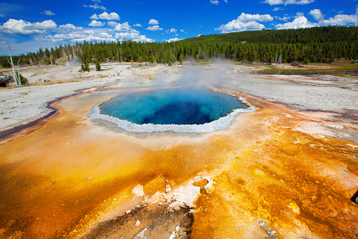 Subject: Chromatic Pool at the Old Faithful Geyser Basin in Yellowstone National Park. A popular tourist destination internationally. A variety of geographic scenes are featured in the park and the surrounding area.
