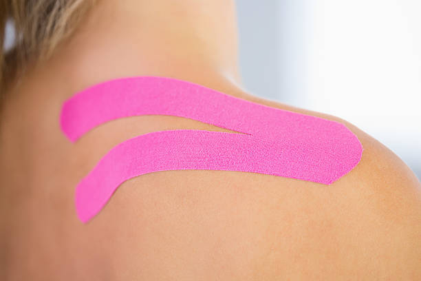 istock Close up of patients shoulder with applied kinesio tape 511024421