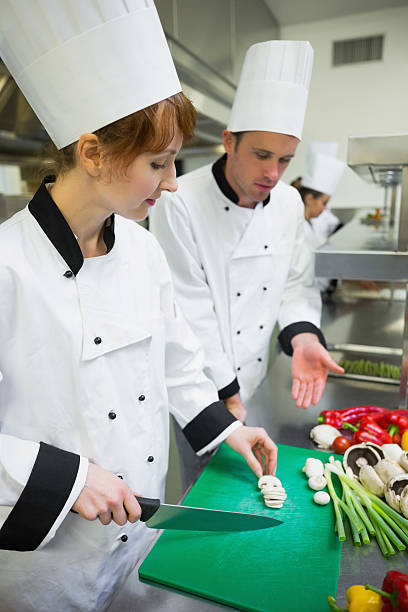 istock Chef looking at his colleagues sliced mushrooms 511024863