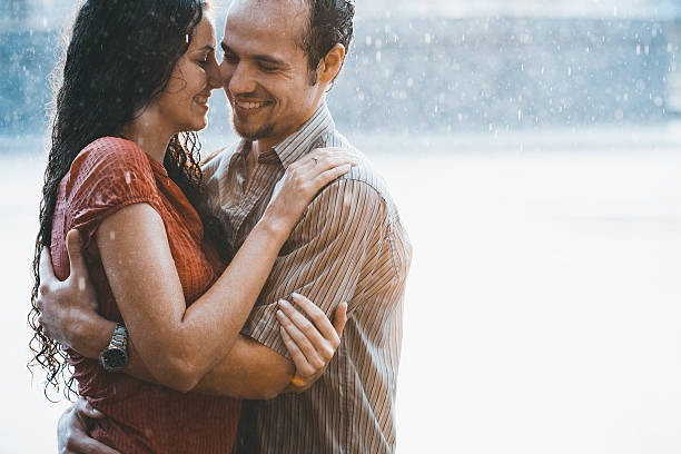 istock Boy and girl hugging in the rain 511025031
