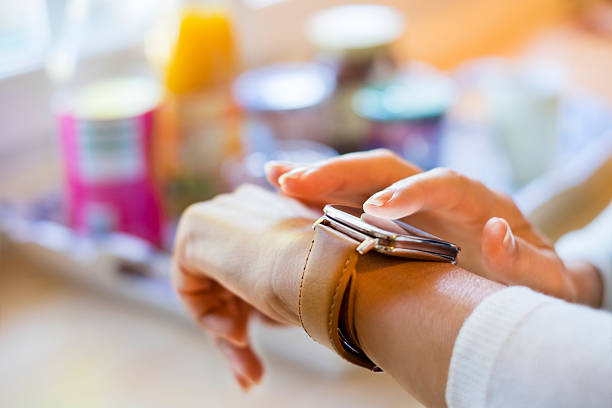 istock Woman at home texting a Message on smartwatch, closeup hands 511025152