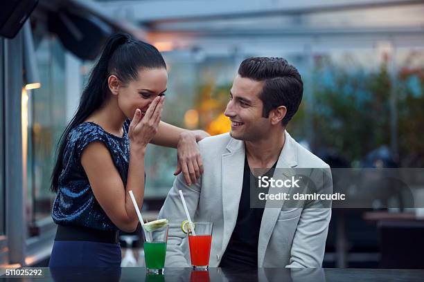Young Couple Having Fun In A Club Stock Photo - Download Image Now - Couple - Relationship, Bar - Drink Establishment, Cocktail