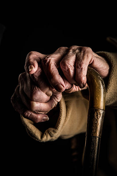 istock Senior woman's hands on walking stick 511026256