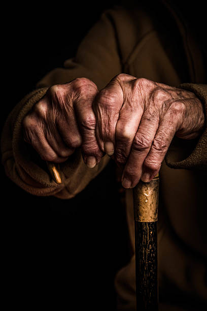 istock Senior woman's hands on walking stick 511026274