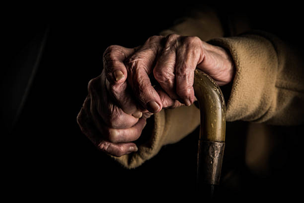 istock Senior woman's hands on walking stick 511026306