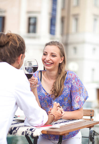 istock Young couple enjoying at the sidewalk cafe 511027415