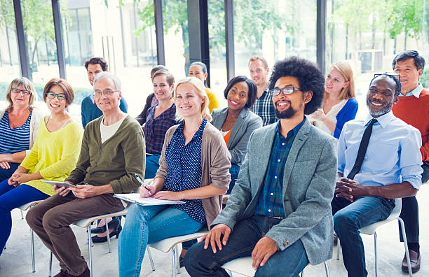 Multiethnic Group of People in Seminar Multiethnic Group of People in Seminar casual clothing stock pictures, royalty-free photos & images
